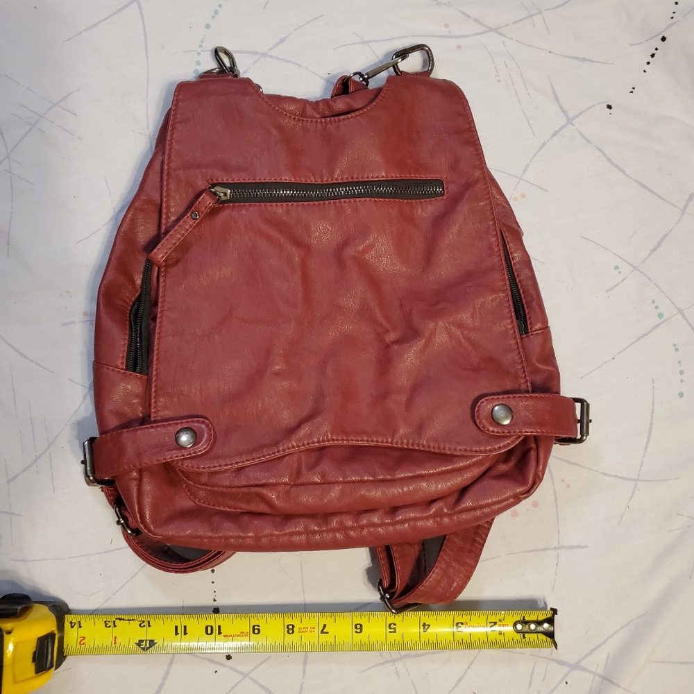 Unlabeled supple red leather mini backpack, adjustable straps -bought @ Wilsons